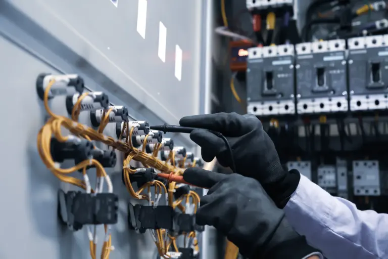 electrical-engineer-using-measuring-equipment-checking-electric-current-voltage-circuit-breaker
